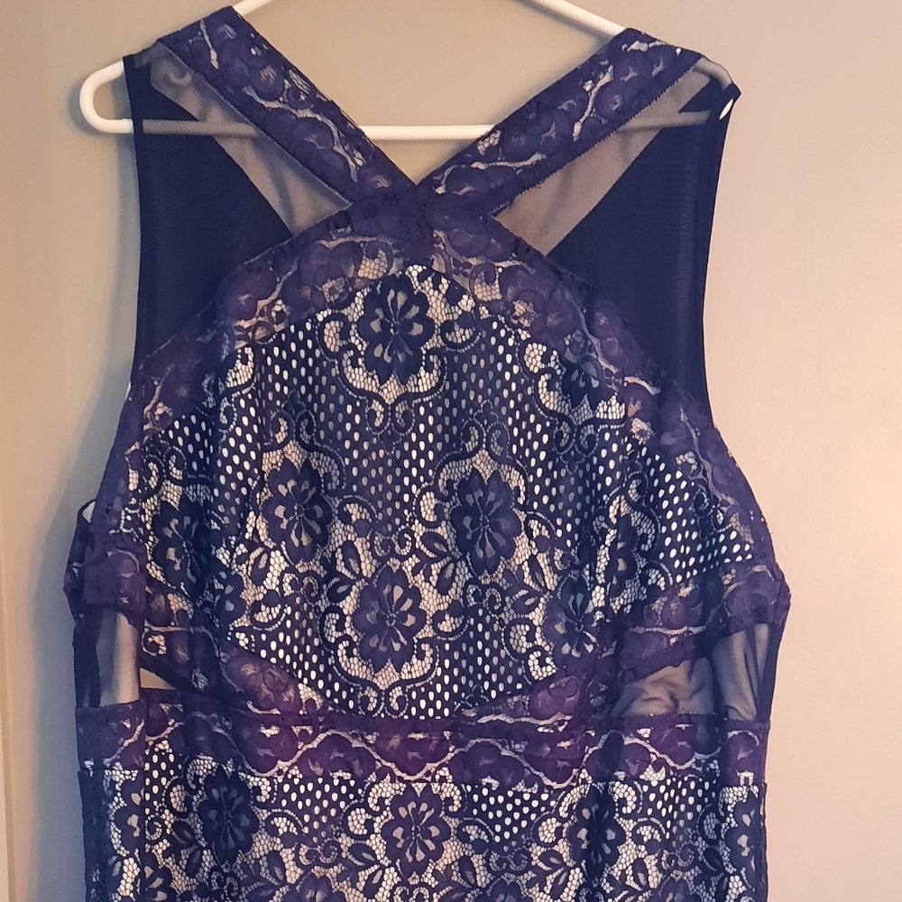 Knee length blue lace over white bodycon dress
